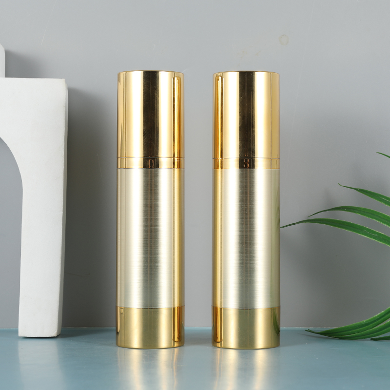 golden metallized round airless bottle