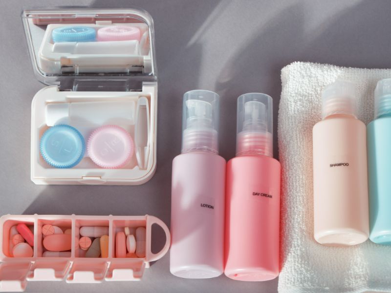 travel kit set bottles cosmetic products kit contact lenses pill organizer towel 1