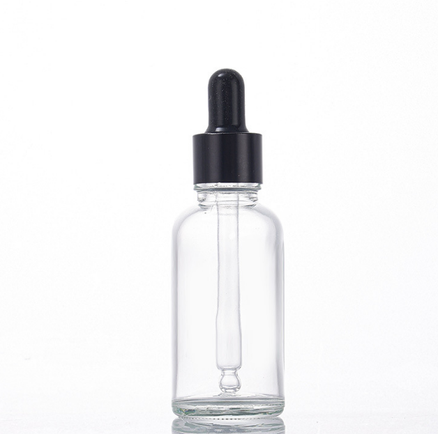 Clear glass dropper bottle with black pipette closure