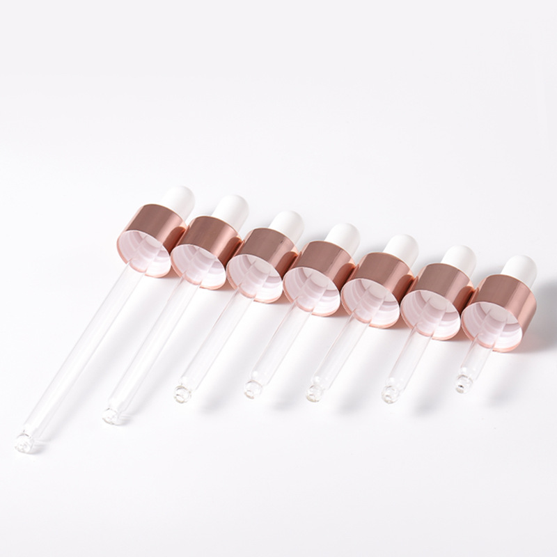 Glass pipette droppers with rose gold collars